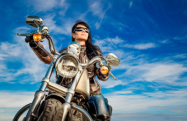 Image showing Biker girl on a motorcycle