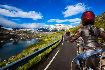 Image showing Biker girl First-person view, mountain serpentine.