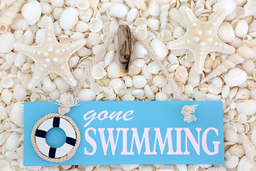 Image showing Gone Swimming Sign on Seashells