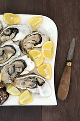 Image showing Oysters on Ice with Lemon