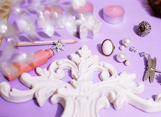 Image showing Jewelry table with lot of girl stuff on it, little mess in cosmetic brushes, women interior concept, perfume elegance things, little princess makeup