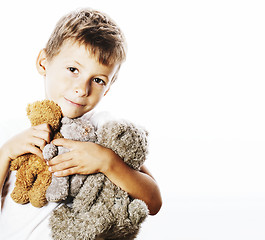 Image showing little cute boy with many teddy bears hugging isolated close up