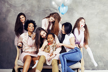 Image showing Lifestyle and people concept: young pretty diversity nations woman with different age children celebrating on birth day party together happy smiling, making selfie. African-american, asian and caucasi