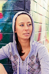 Image showing young pretty brunette teenage girl posing friendly outside, lifestyle people concept