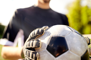 Image showing close up of goalkeeper with ball playing football