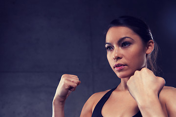 Image showing woman holding fists and fighting in gym