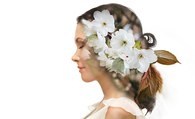 Image showing beautiful young woman with cherry blossoms