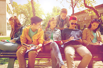 Image showing group of students with notebooks at school yard