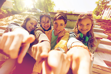 Image showing teenage friends or students pointing finger at you