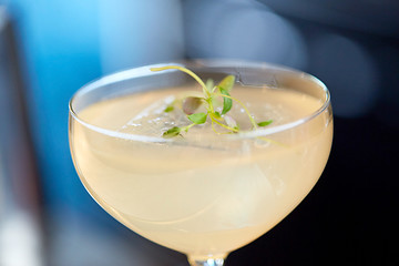 Image showing close up of glass with cocktail at bar