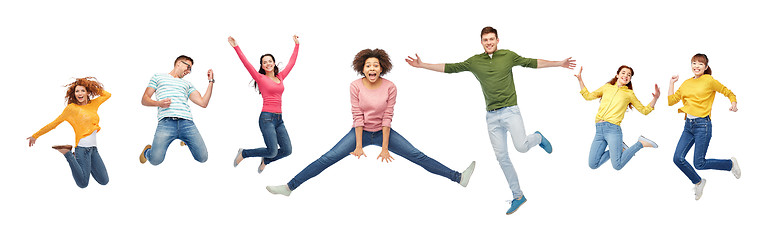 Image showing happy people or friends jumping in air over white