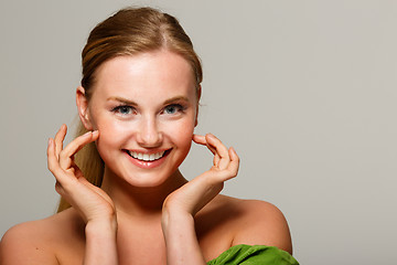 Image showing Smiling girl on gray background