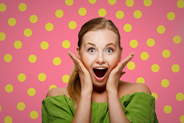 Image showing Surprised woman in green sweater