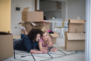 Image showing Young couple moving in a new flat