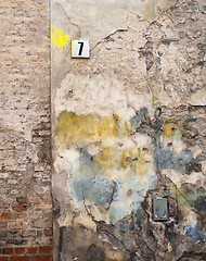 Image showing colorful brick wall and plate with a number seven