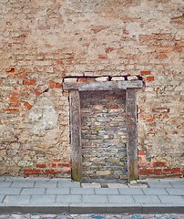 Image showing cracked brick wall with bricked up doorway