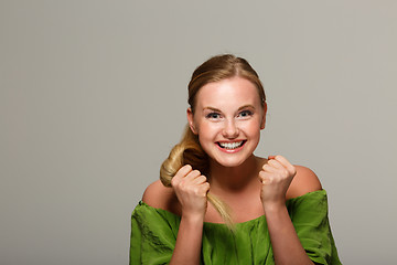 Image showing Cheerful woman in green dress