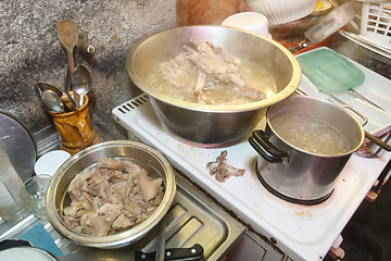 Image showing Cooking pork on stove