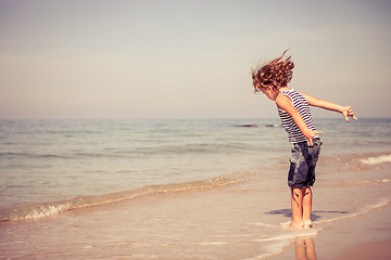 Image showing  Portrait of little boy standing on the beach