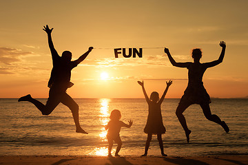 Image showing Happy family standing on the beach