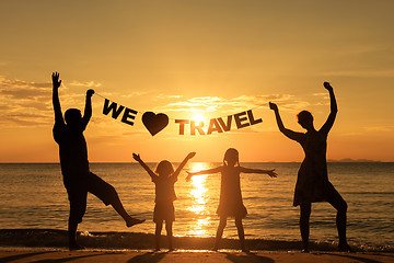 Image showing Happy family standing on the beach