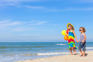 Image showing happy children playing on the beach