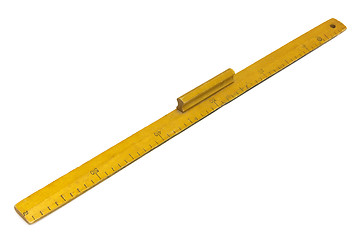 Image showing Yellow wooden measuring ruler on a white background