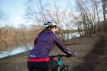 Image showing Girl rides bike at park