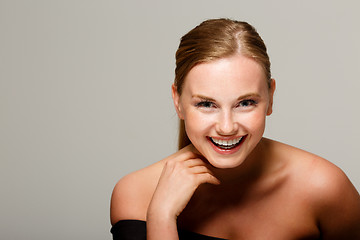 Image showing Smiling girl with bare shoulders