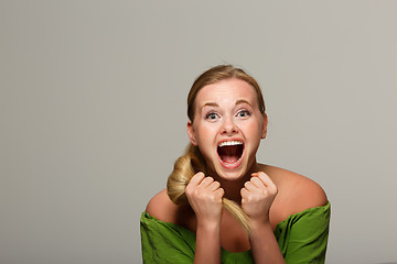 Image showing Screaming woman in green dress