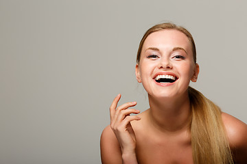 Image showing Smiling model on gray background