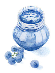 Image showing Blueberries and jar filled by blueberry jam over white backgroun