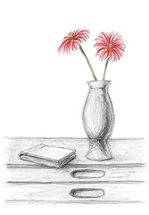 Image showing Two red flowers in a vase on desk with book