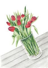 Image showing Bunch of a tulips in a glass vase on a table