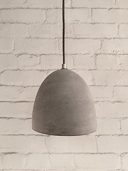 Image showing Concrete lamp on white brick background