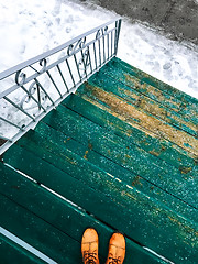 Image showing Green wooden staircase and winter street
