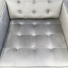 Image showing Silky fashionable armchair with decorative buttons