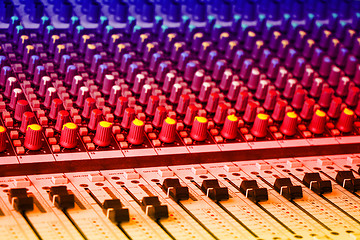 Image showing Sound mixing console with colorful backlit buttons