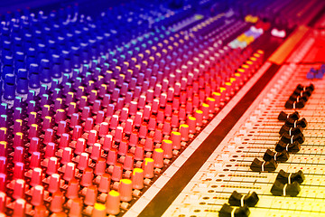 Image showing Sound mixing console with colorful backlit buttons