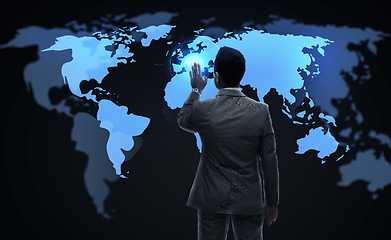 Image showing businessman working with virtual world map