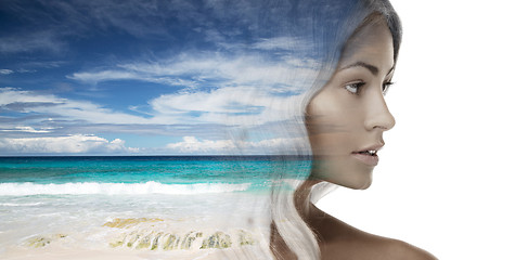 Image showing beautiful young woman face over beach background