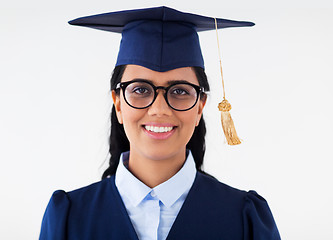 Image showing happy bachelor woman in mortarboard with diplomas