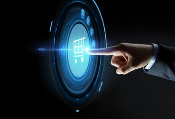 Image showing male hand pointing finger to shopping cart icon