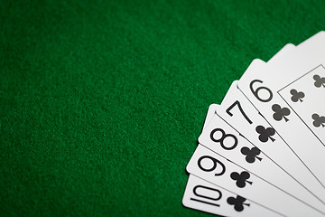 Image showing poker hand of playing cards on green casino cloth