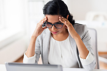 Image showing stressed businesswoman with laptop at office