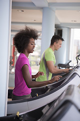 Image showing people exercisinng a cardio on treadmill in gym