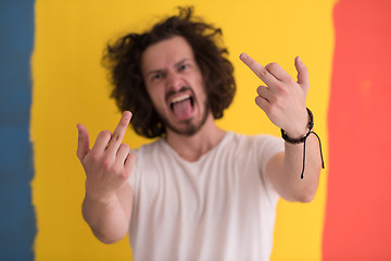 Image showing young man with funny hair over color background