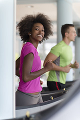 Image showing people exercisinng a cardio on treadmill