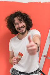Image showing man with funny hair over color background with brush