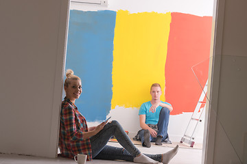 Image showing Happy young couple relaxing after painting